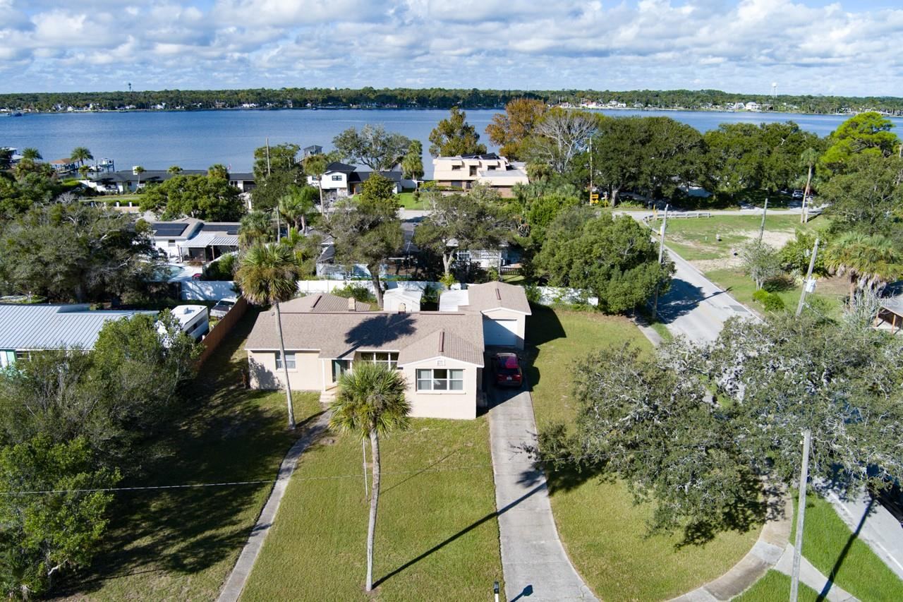 Photo 1 of 20: Front of home showing location to Halifax River