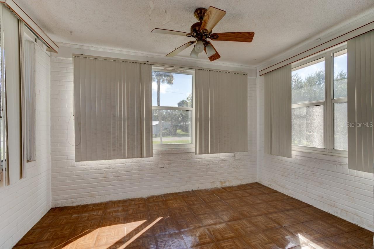 Photo 7 of 20: Florida Room at front of home facing NE