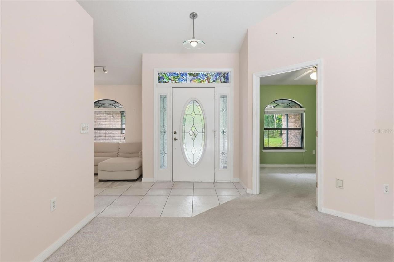 Photo 6 of 20: Living room looking to front door.