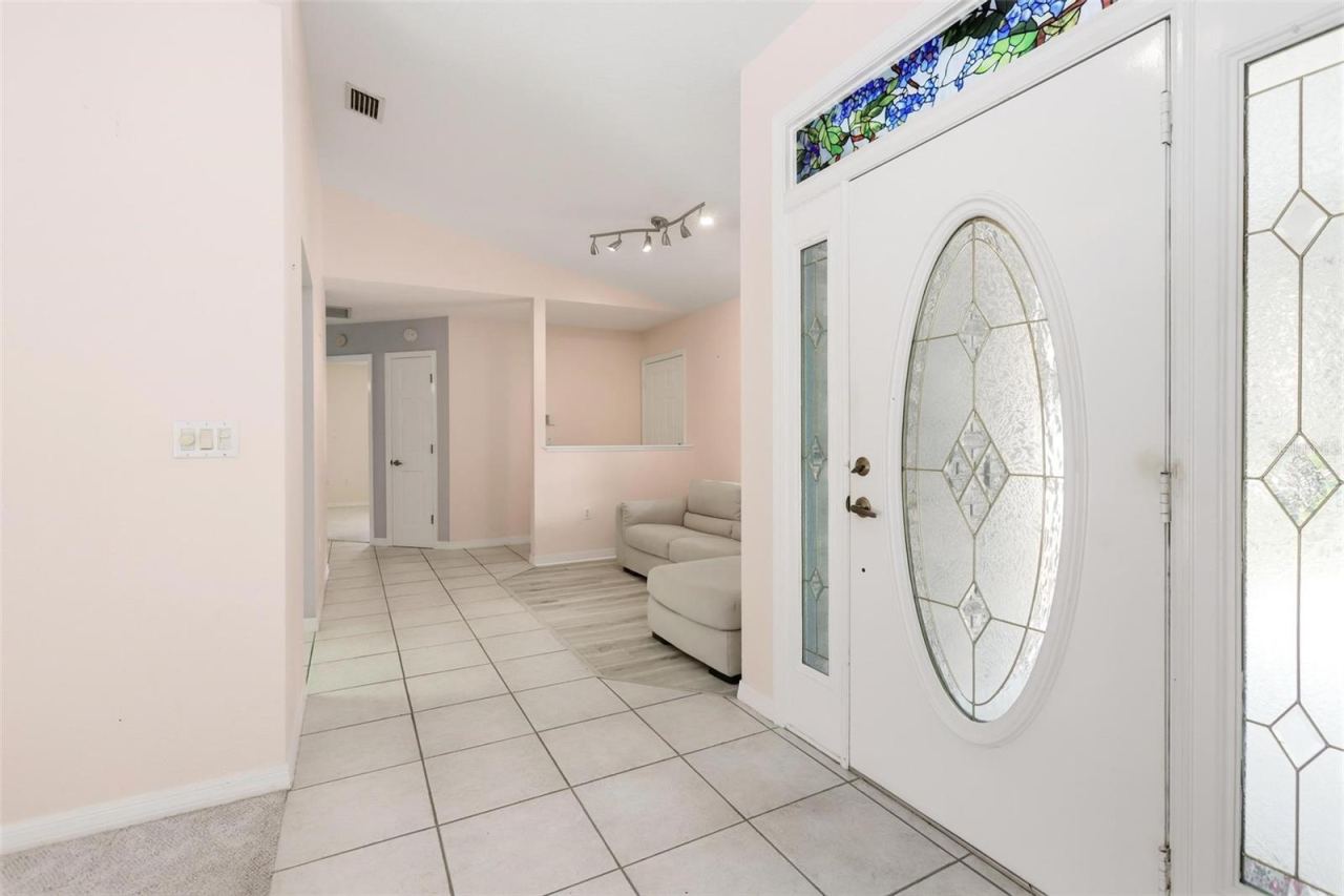 Photo 4 of 20: Front entrance looking to bedroom #2.