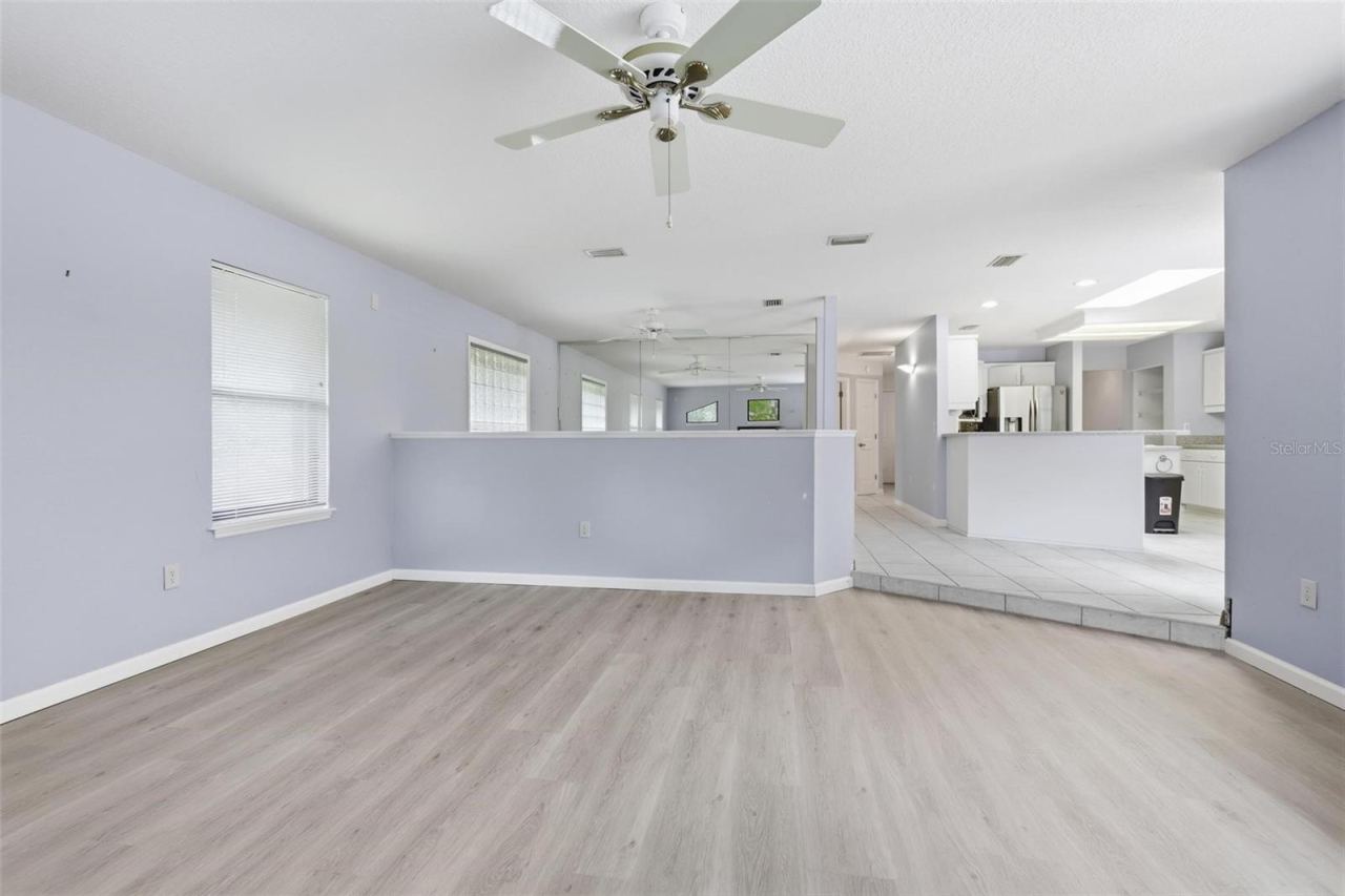 Photo 17 of 20: Family room. Flex space straight ahead. Kitchen on right.