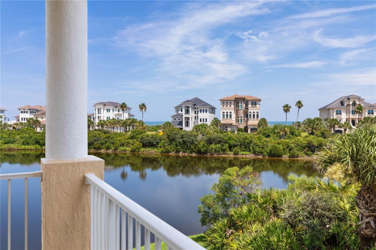 Photo 6 of 20: Look a little farther and there it is. Beyond the lake and rooftops, the Atlantic meets the horizon, bringing the beauty of Ocean Hammock’s coastal setting into view.
