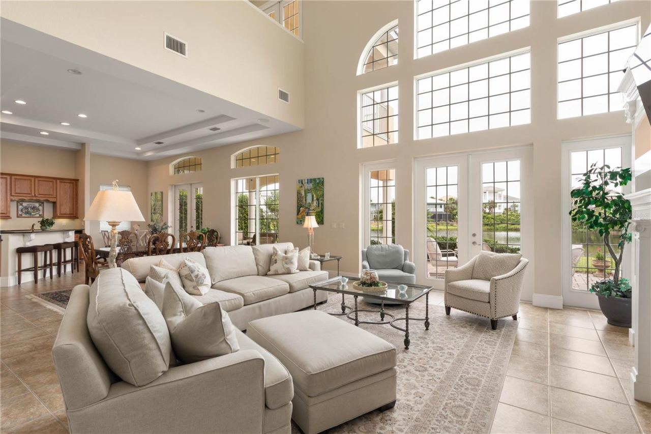 Photo 3 of 20: Inside, natural light takes over. The soaring wall of glass creates an incredible sense of openness, bringing the surrounding landscape into the heart of the home.