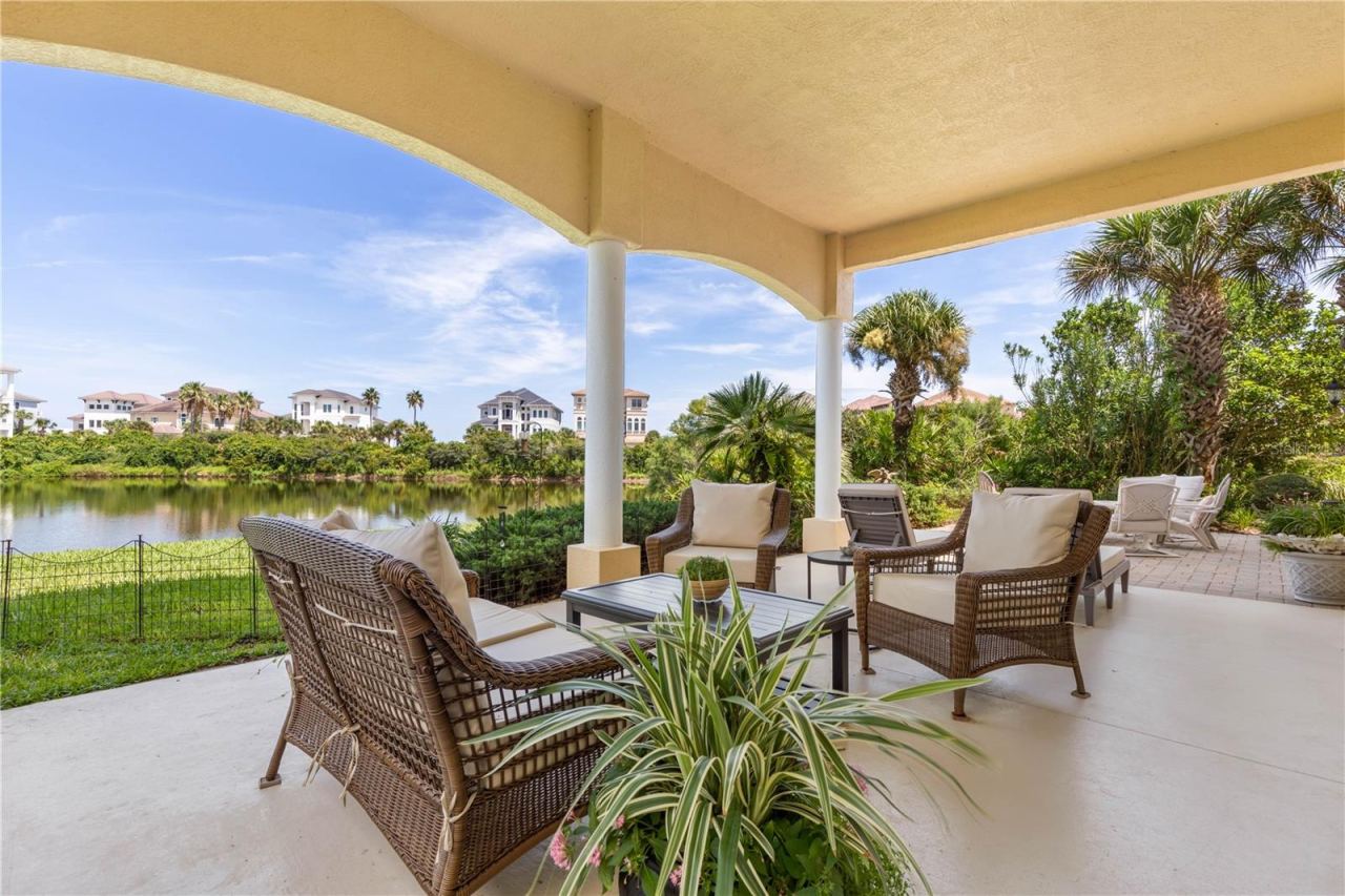 Photo 5 of 20: Step outside and the living continues. The covered lanai offers a comfortable setting for conversation, casual meals or simply enjoying the Florida air without leaving the comforts of home.