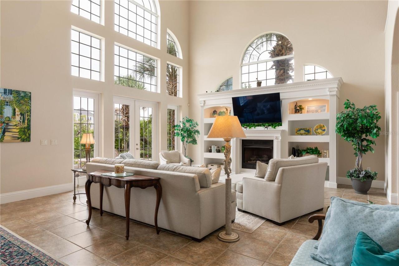 Photo 18 of 20: For all its impressive scale, this home still knows how to feel cozy. The family room fireplace creates a natural gathering place for quiet evenings and time together.