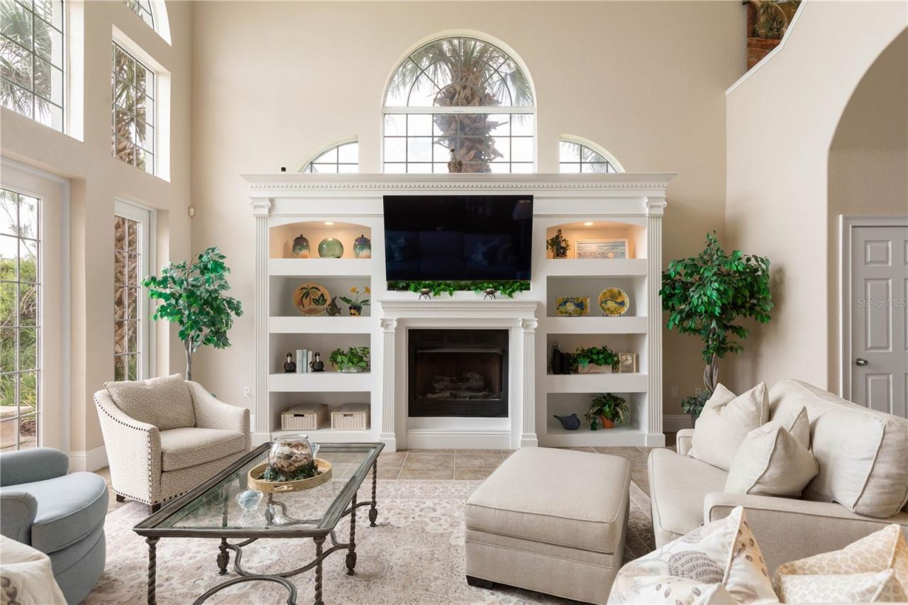 Photo 19 of 20: The antique mantel brings a story of its own, with hand carved dentil detailing across the top. Custom bookcases were then crafted to complement the mantel, creating a focal point that feels collected rather than simply designed.
