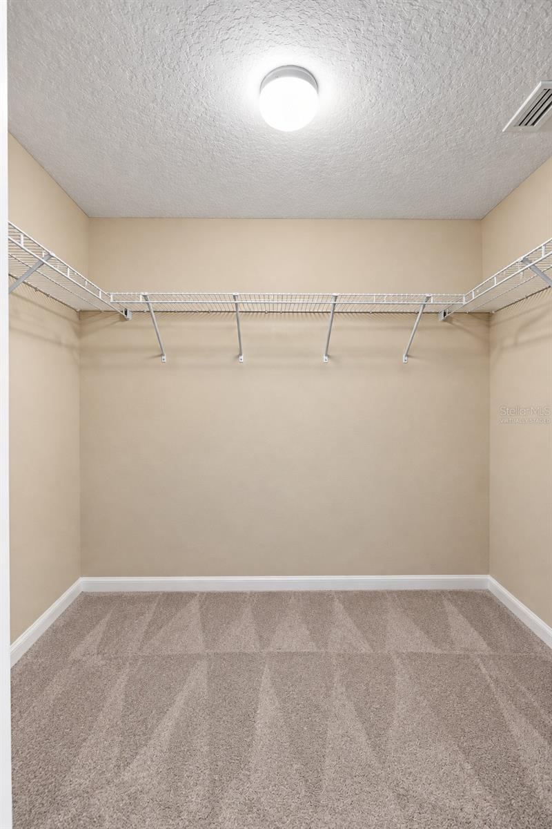 Photo 12 of 20: MASTER CLOSET- 1 OF 2- VIRTUALLY STAGED