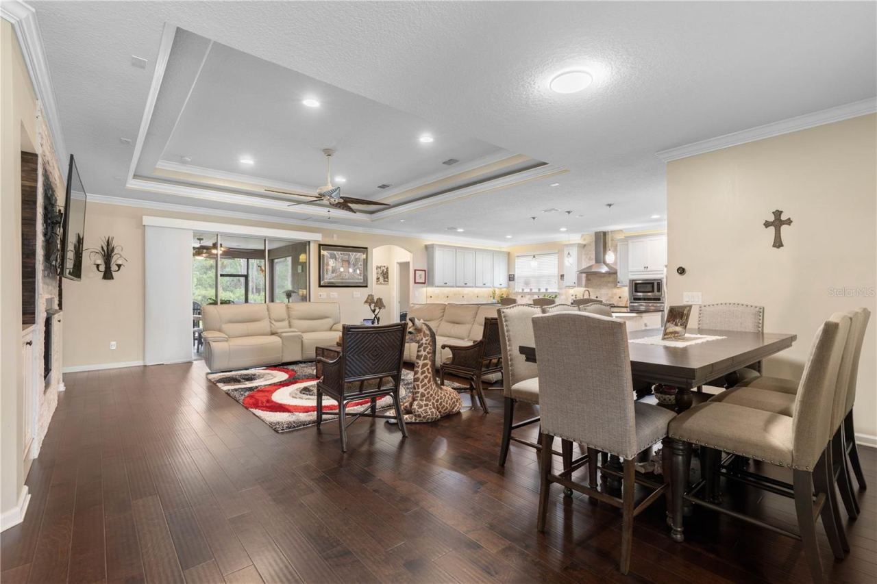 Photo 14 of 20: An open floor plan keeps the living, dining, and kitchen spaces effortlessly connected—perfect for entertaining, everyday moments, and never missing out on the conversation.