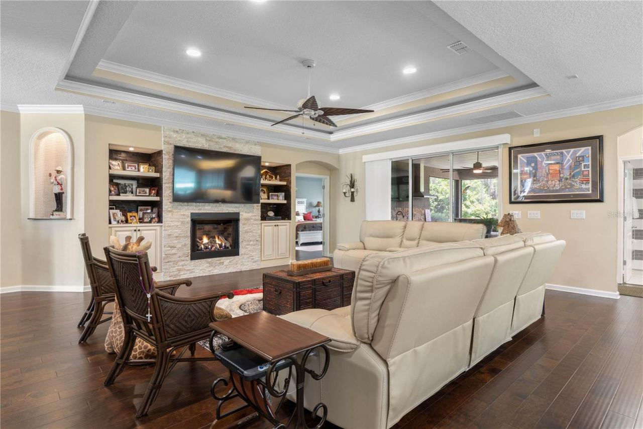 Photo 2 of 20: Where cozy meets character—hand-scraped wood floors set the stage for everyday living, while the gas fireplace creates the perfect spot to gather, unwind, and feel right at home.