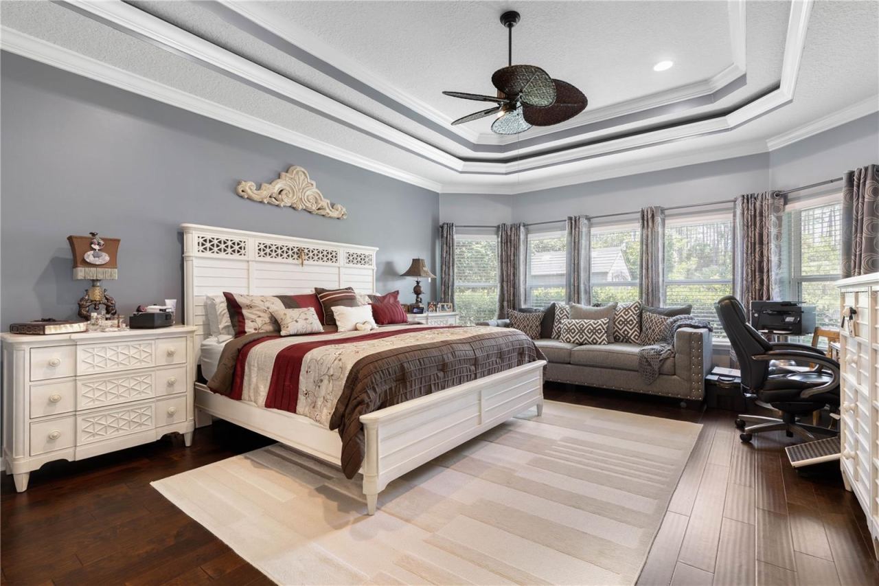 Photo 7 of 20: Your own private retreat—the spacious primary ensuite is crowned by a dramatic double-tray lighted ceiling, bringing beautiful dimension and ambiance to the room.