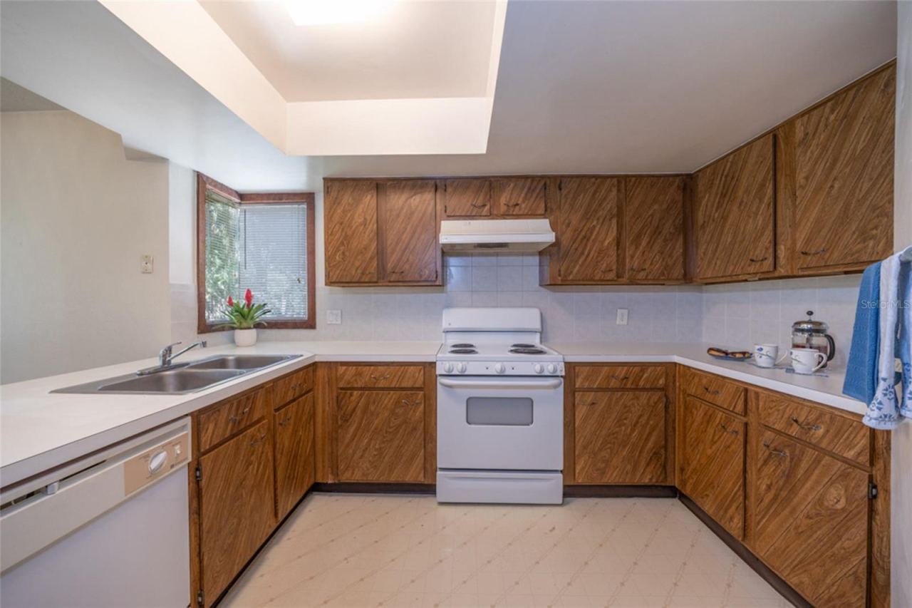 Photo 6 of 20: UNSTAGED: Kitchen With Modern "European Style" Flat Panel Kitchen Doors