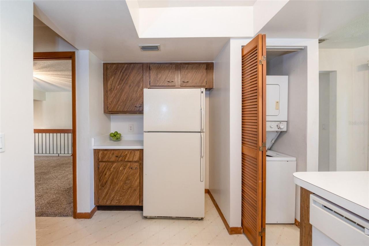 Photo 8 of 20: Laundry Closet In he Kitchen. Stackable Unit Conveys