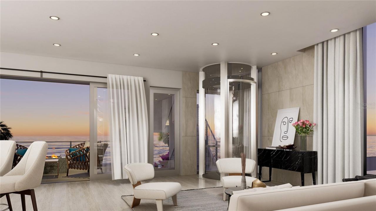 Photo 14 of 17: Living Room Ocean view at dusk.- Virtually Staged