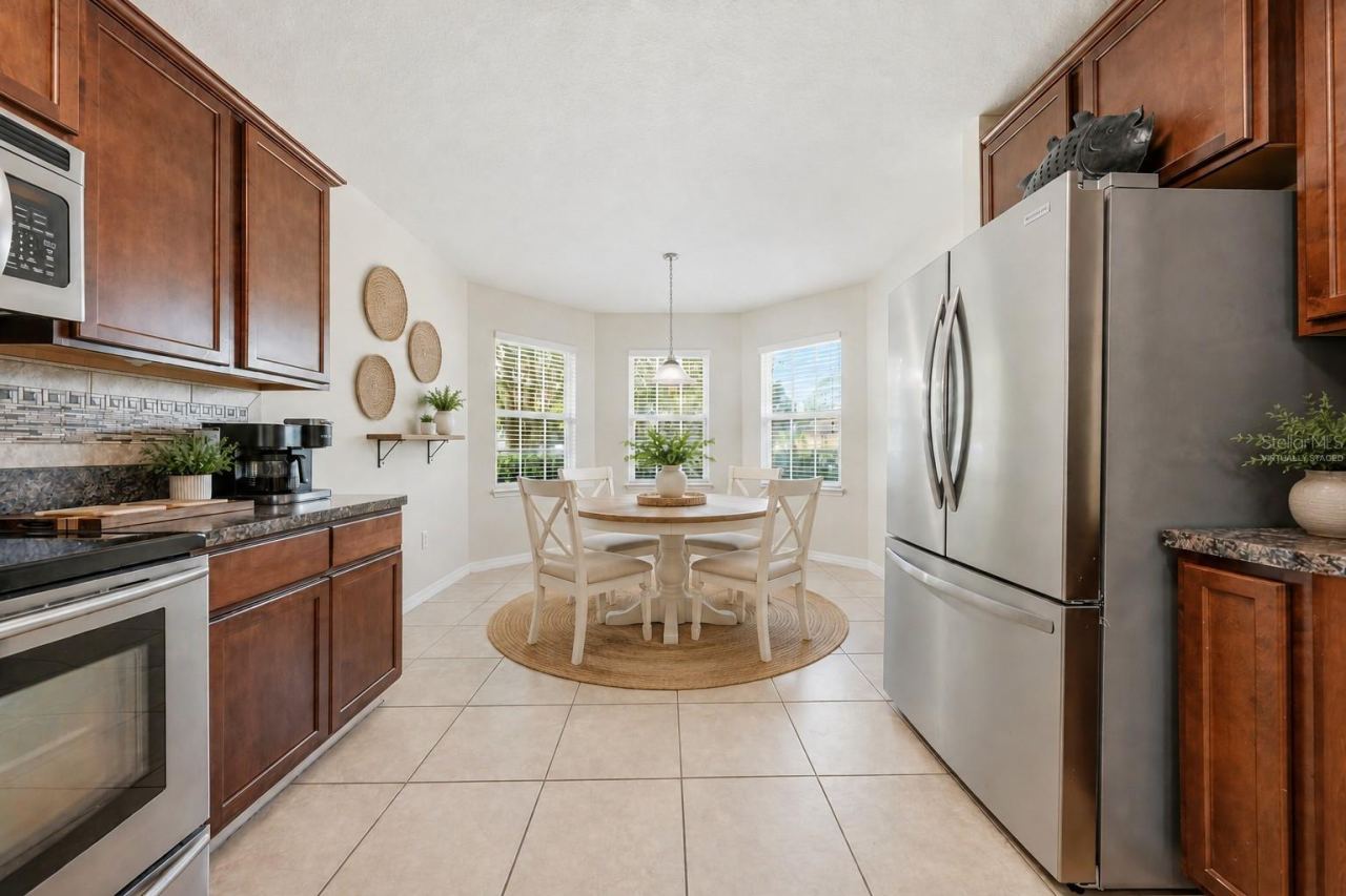 Photo 8 of 20: Bright eat -in kitchen.Dinette is virtually staged