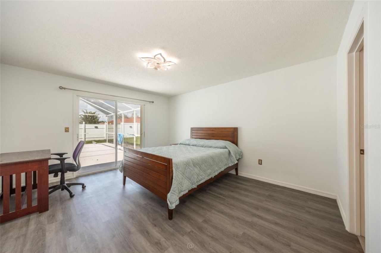 Photo 17 of 20: large primary suite with sliders to pool