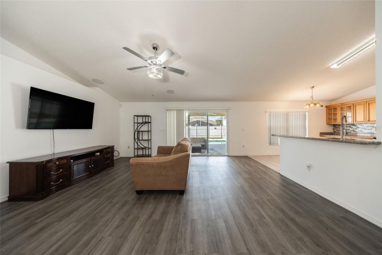 Photo 8 of 20: large family room & LVP flooring throughout, except kitchen, foyer & primary bath which are tile