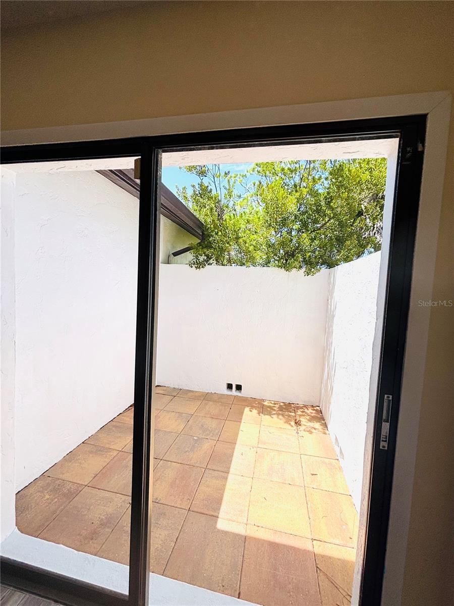 Photo 19 of 20: Primary bedroom with private patio