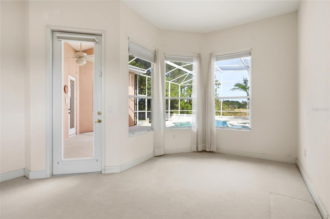 Photo 14 of 20: A windowed nook extends the primary suite with space for a private sitting area, readingcorner, or home office.