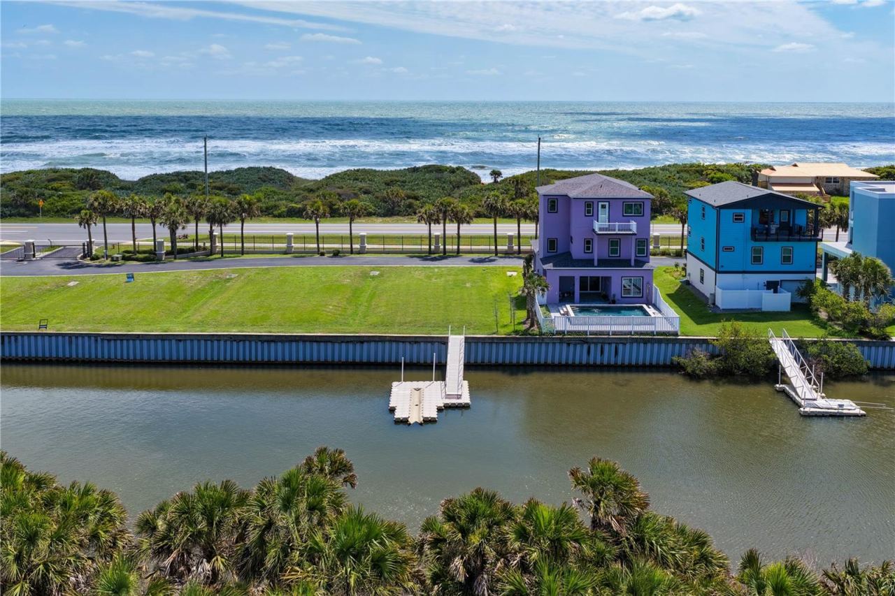 Photo 2 of 20: Build your dream coastal retreat on this exceptional waterfront homesite featuring a private floating dock, Intracoastal access, and deeded beach access just steps from the Atlantic Ocean.
