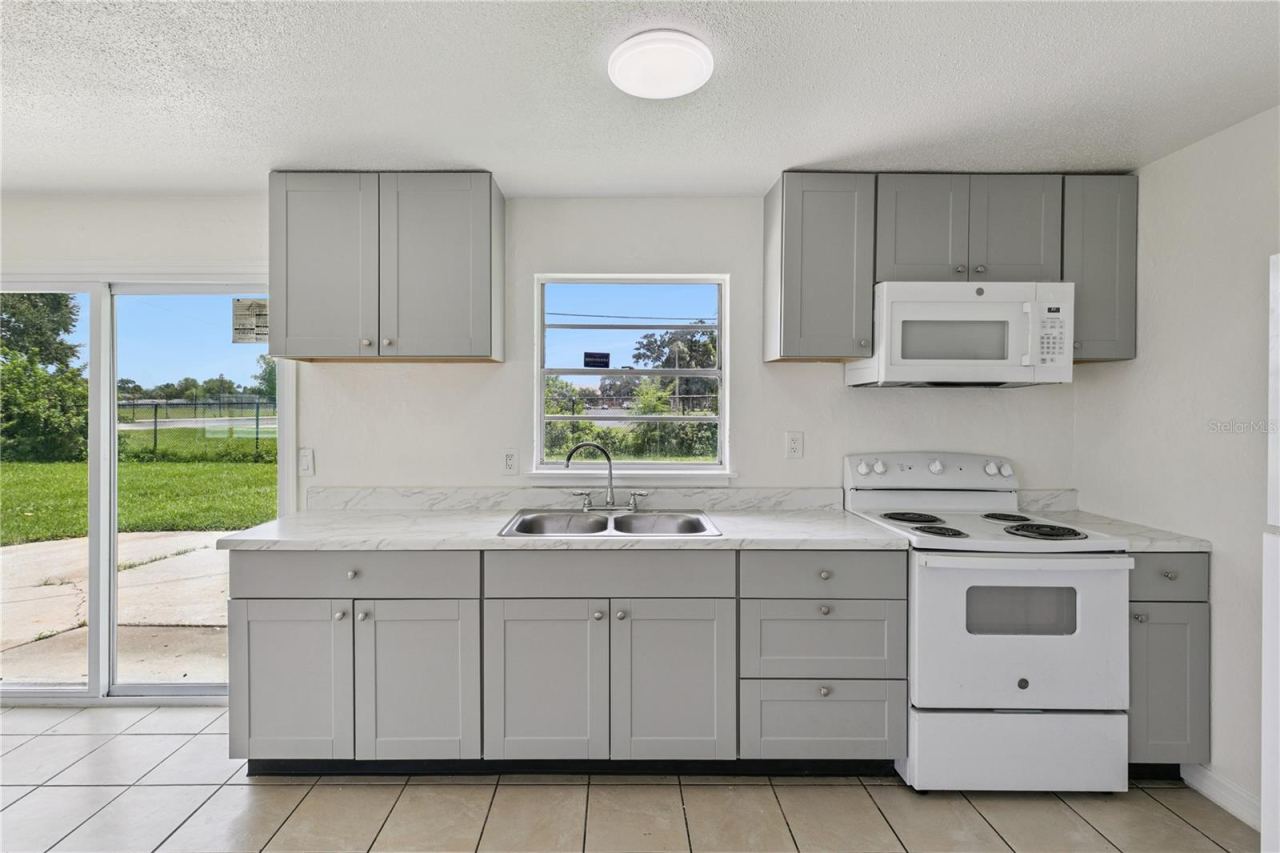 Photo 10 of 20: Bright Kitchen Overlooking Oversized Backyard