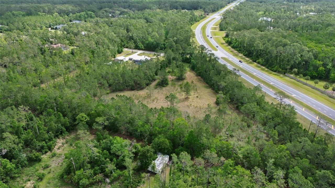 Photo 5 of 13: Drone view of property