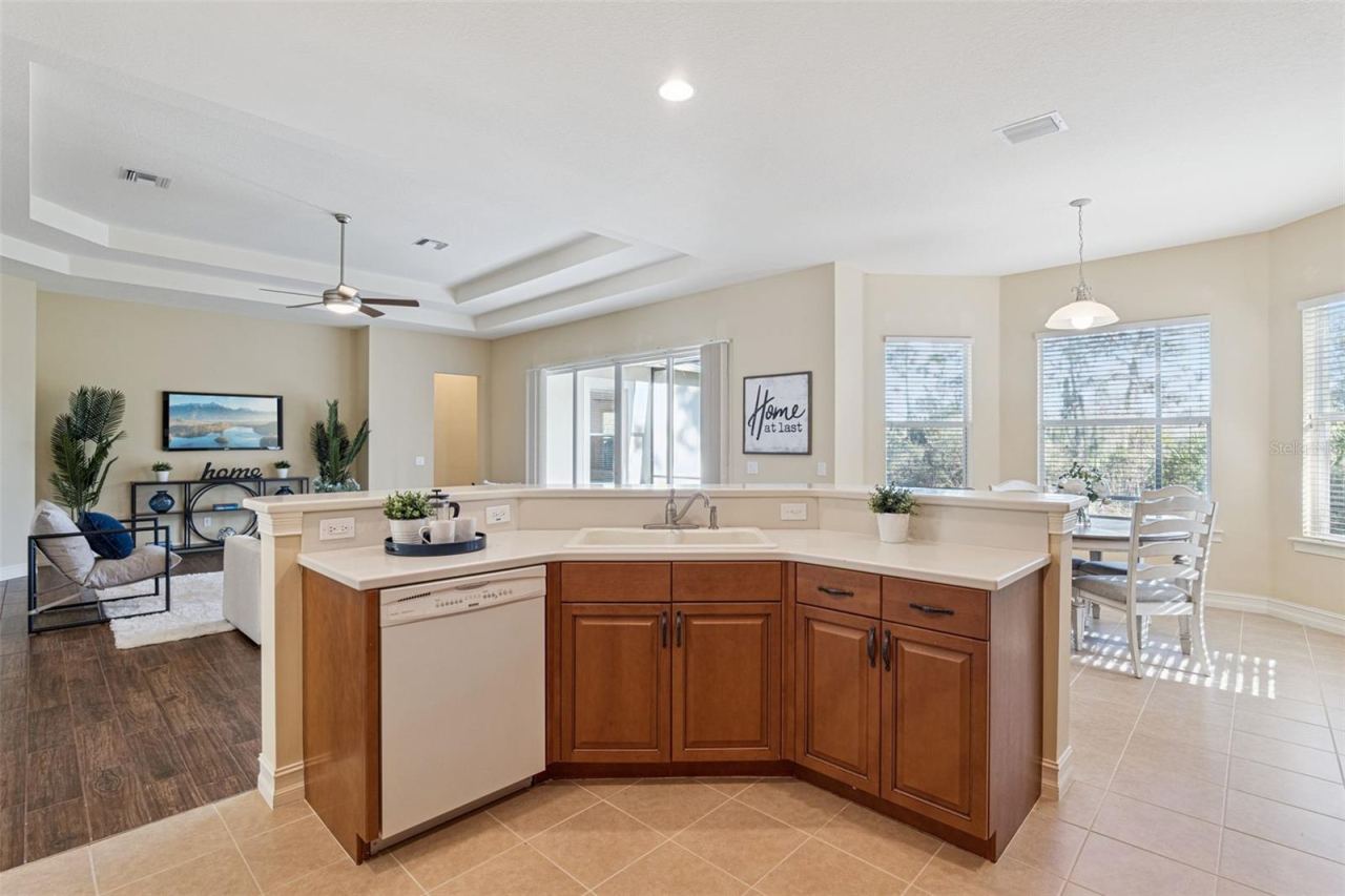 Photo 12 of 20: View from the Kitchen to the Family Room & Dinette areas