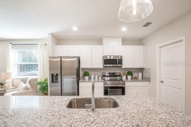 Photo 6 of 20: Model home - actual features may vary.