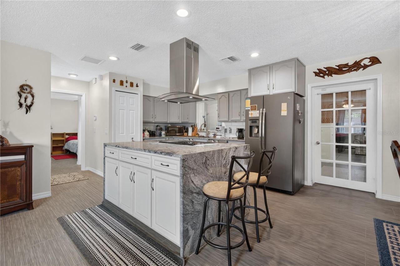 Photo 7 of 20: View of the entire kitchen with granite countertops and stainless steel appliances