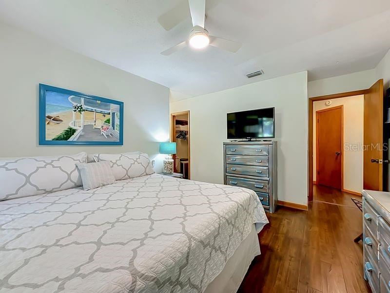 Photo 15 of 20: Primary Bedroom: Engineered Wood flooring - view to ensuite bath