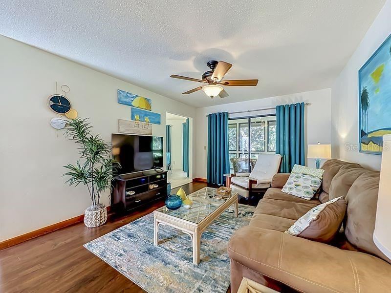 Photo 8 of 20: Living Room with view of cafe nook to the left- slider to Florida Room