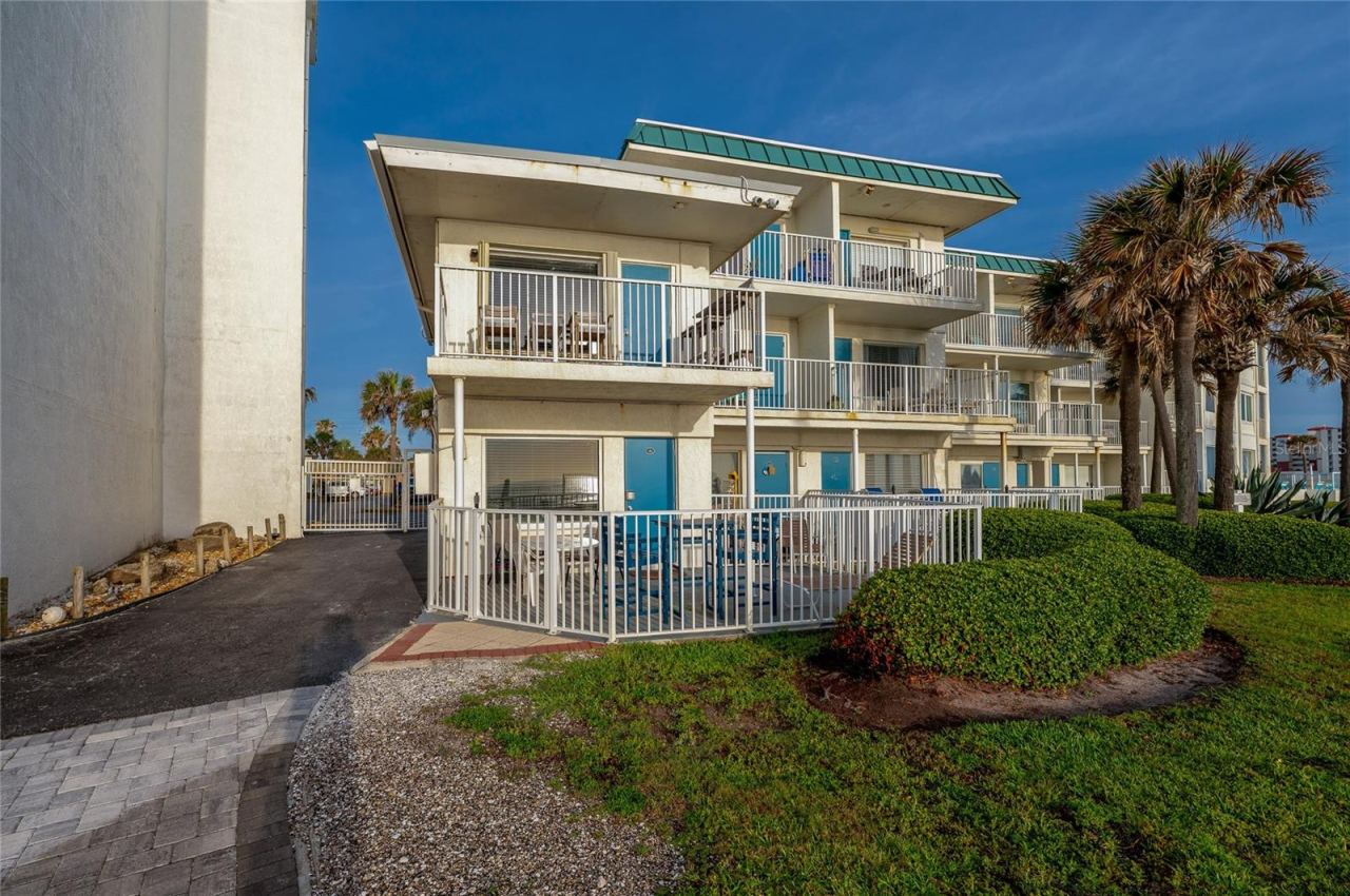 Photo 5 of 20: Prime ground-floor unit location nestled within a charming oceanfront complex. This unit offers the ultimate convenience with "walk-out" access to the pool, beach, and parking.