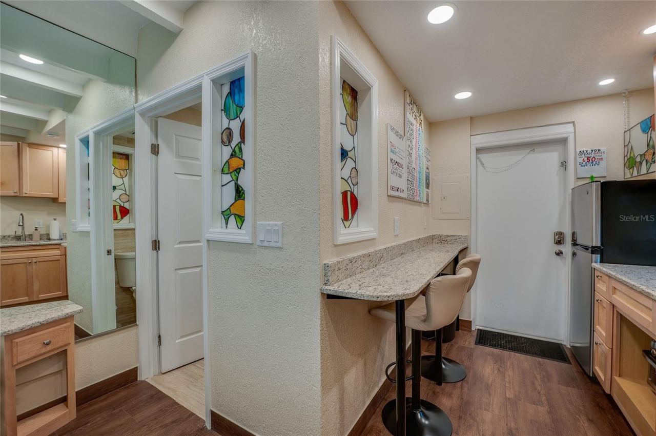 Photo 14 of 20: A convenient built-in bar area with seating offering a space-saving dining solution that's perfect for a quick breakfast or a casual meal.