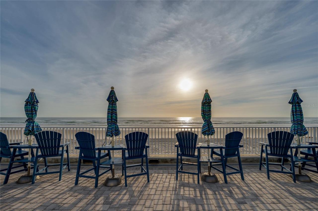 Photo 8 of 20: Coastal community layout highlighting the easy flow between the residential buildings, outdoor dining areas, and the direct beach access point.