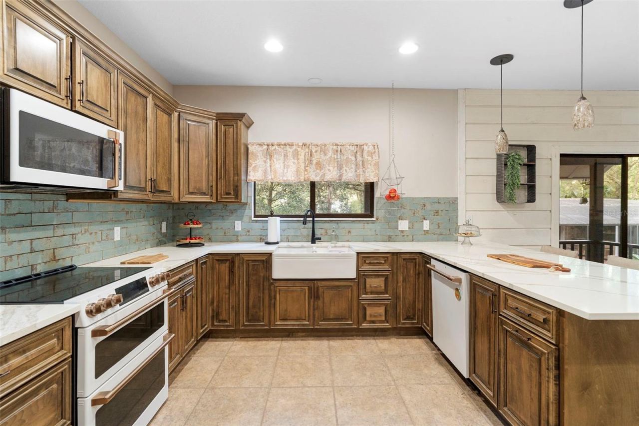 Photo 4 of 20: Main home Kitchen Apron Sink and GE Cafe Appliances