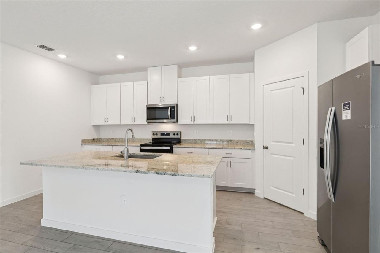 Photo 11 of 15: The interior photos are of another home with the same floor plan and interior finishes. Some details may vary