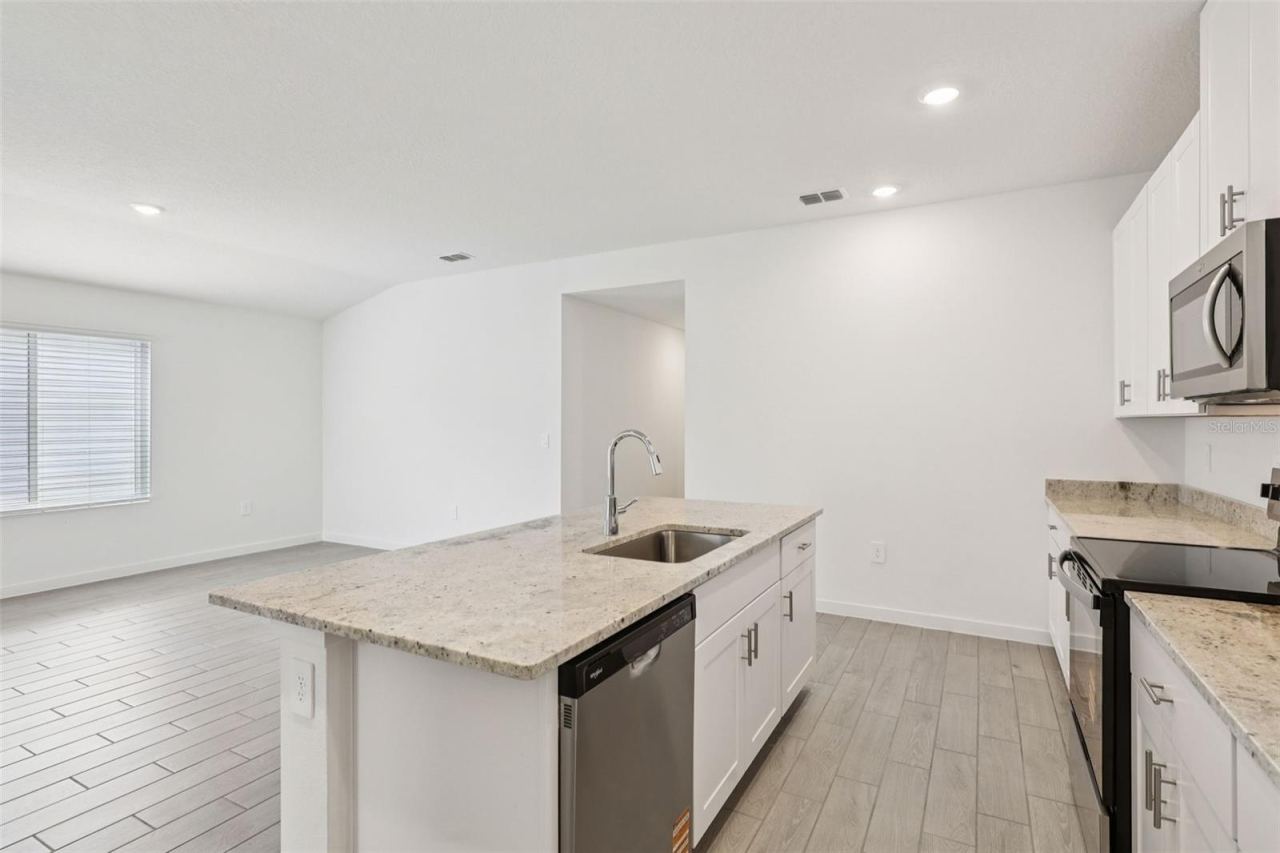 Photo 4 of 15: The interior photos are of another home with the same floor plan and interior finishes. Some details may vary