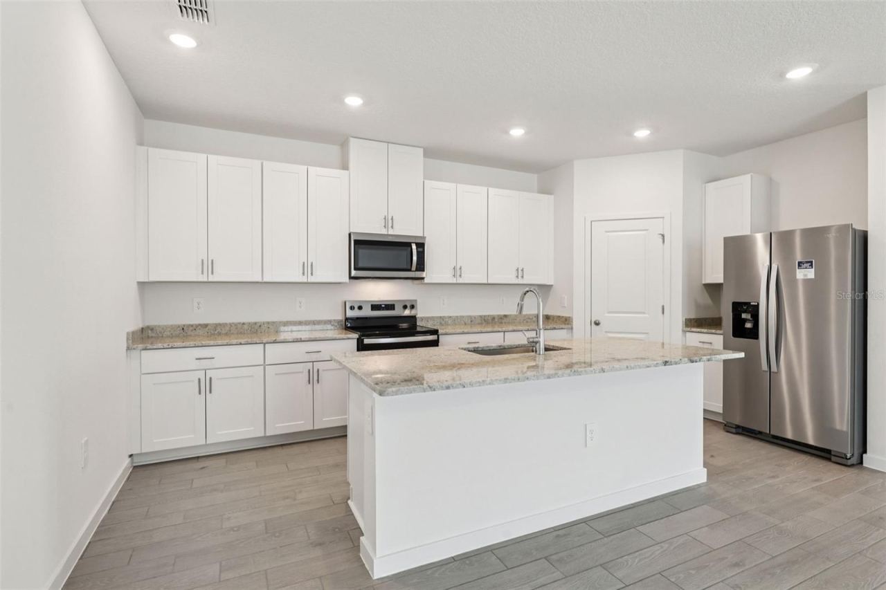 Photo 3 of 15: The interior photos are of another home with the same floor plan and interior finishes. Some details may vary