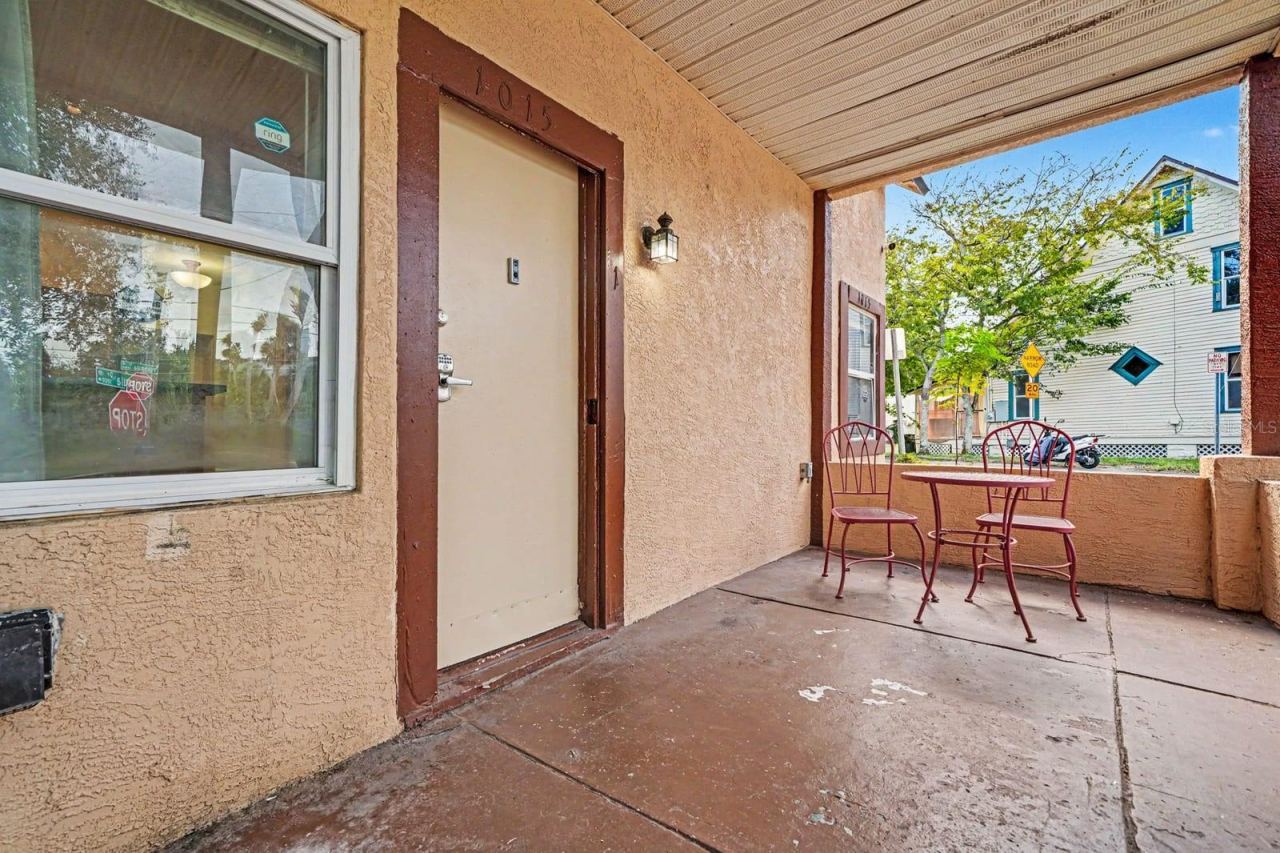 Photo 5 of 20: Front Porch Seating Area With Covered Overhang & Windows