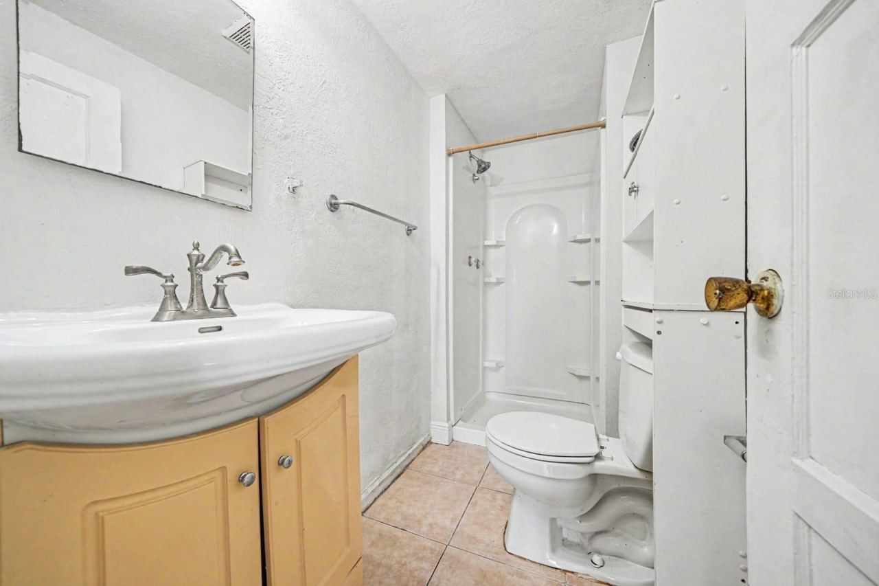 Photo 20 of 20: Guest Bath with Yellow Vanity, Shower Enclosure & Ceramic Tile