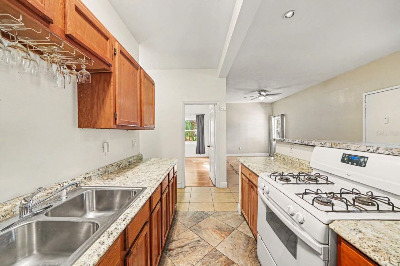 Photo 11 of 20: Spacious Kitchen Featuring Dual Gas Ranges, Granite Tops & Wood Cabinetry