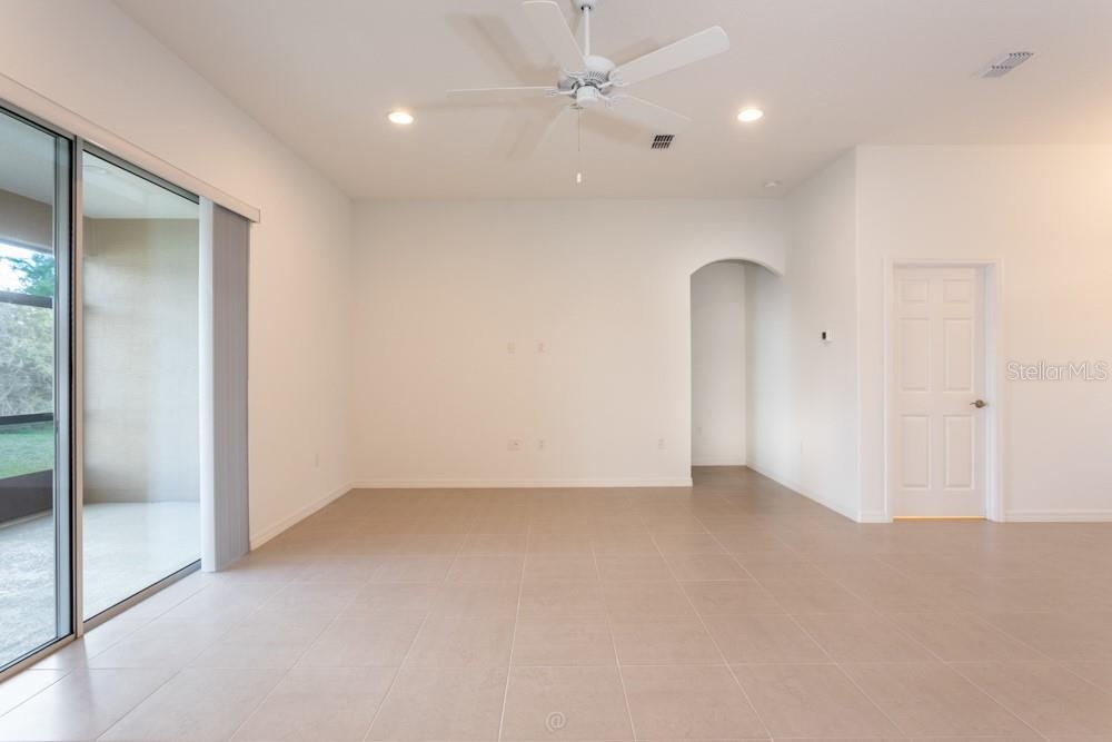 Photo 14 of 20: Living room with glass sliders to rear porch