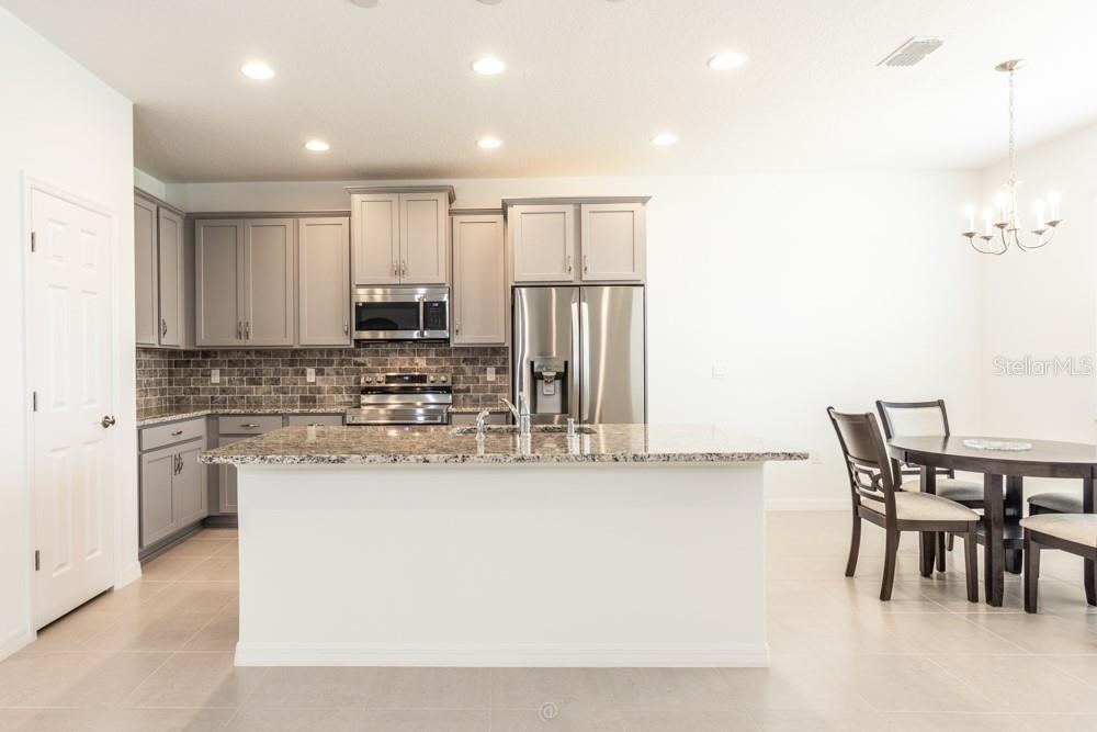 Photo 6 of 20: Kitchen area open to living room