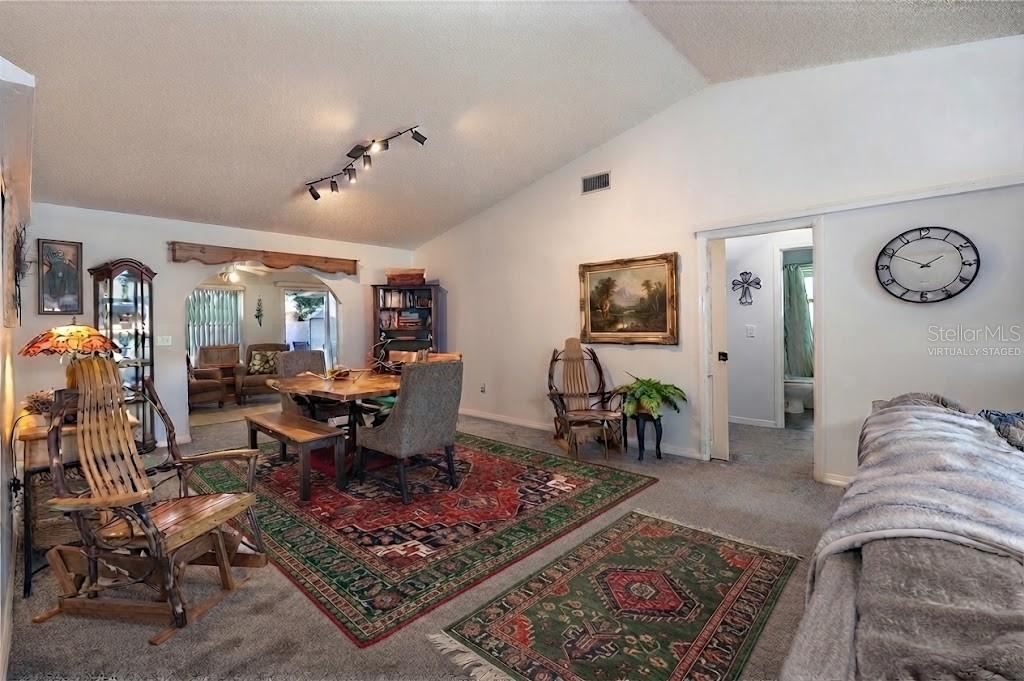 Photo 16 of 20: Virtually Staged Dining Area With Vaulted Ceiling
