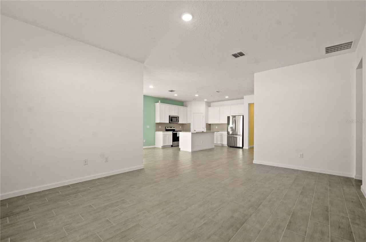 Photo 12 of 20: Living room looking to kitchen.