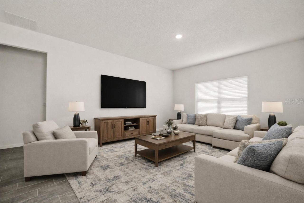Photo 13 of 20: This photo has been virtually staged. View of living room from dining area.