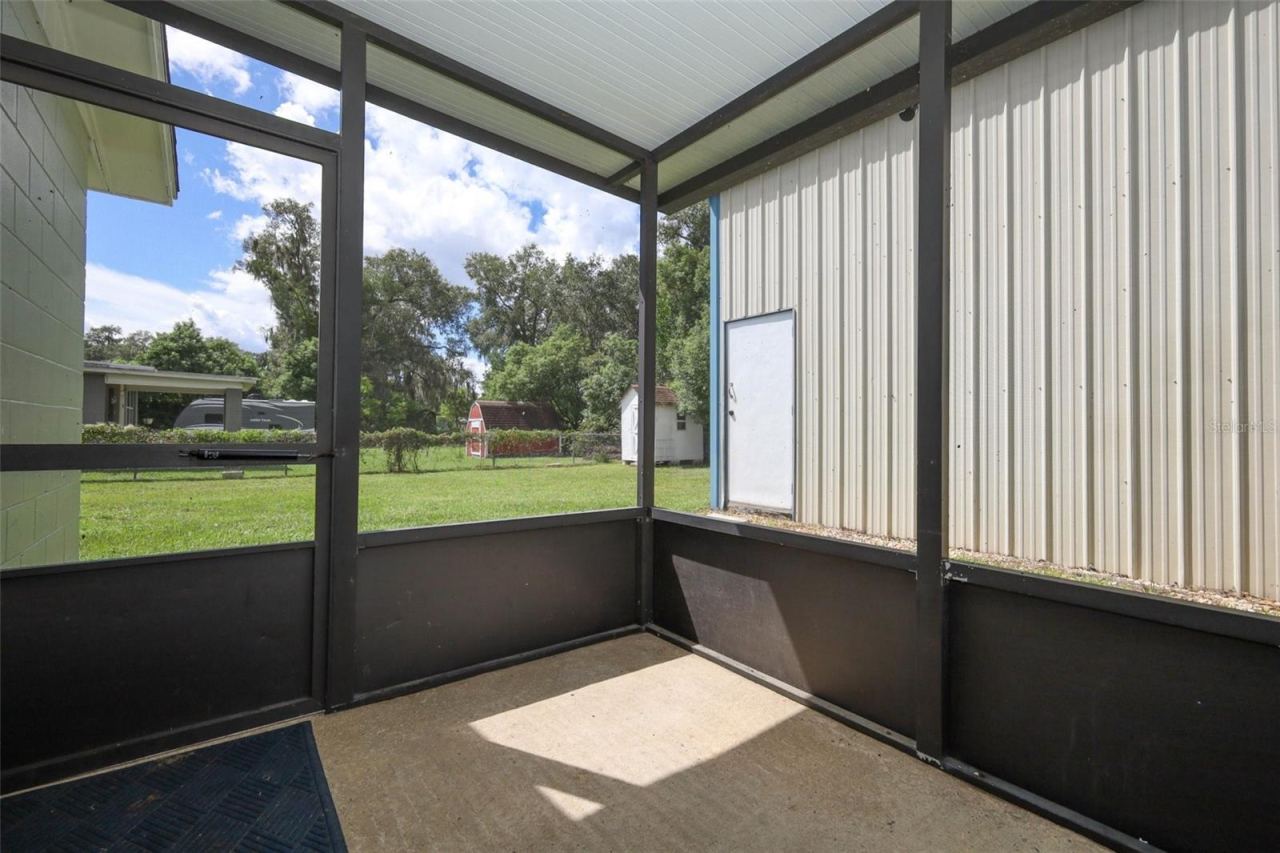 Photo 18 of 20: Screened Patio and Yard