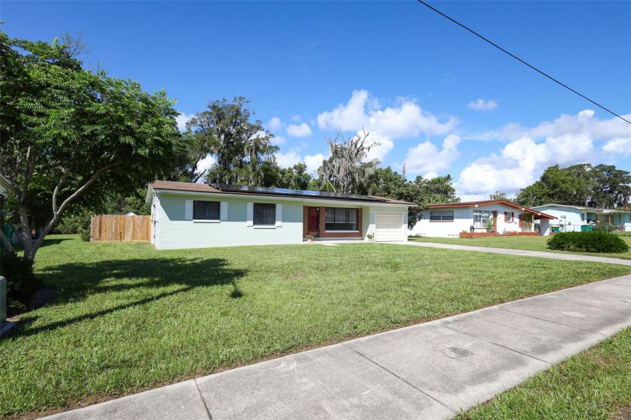 Photo 2 of 20: Large Front Yard with Fenced Backyard