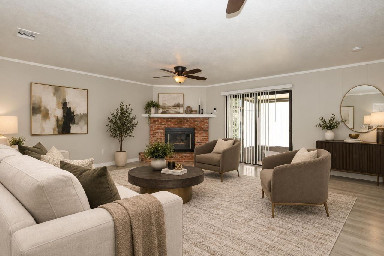 Photo 11 of 20: Virtually Staged- Family Room with Access to screened porch area