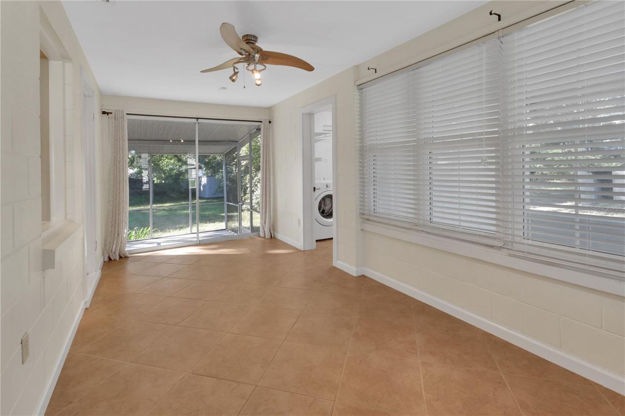 Photo 6 of 20: Bonus room with view of screened back porch