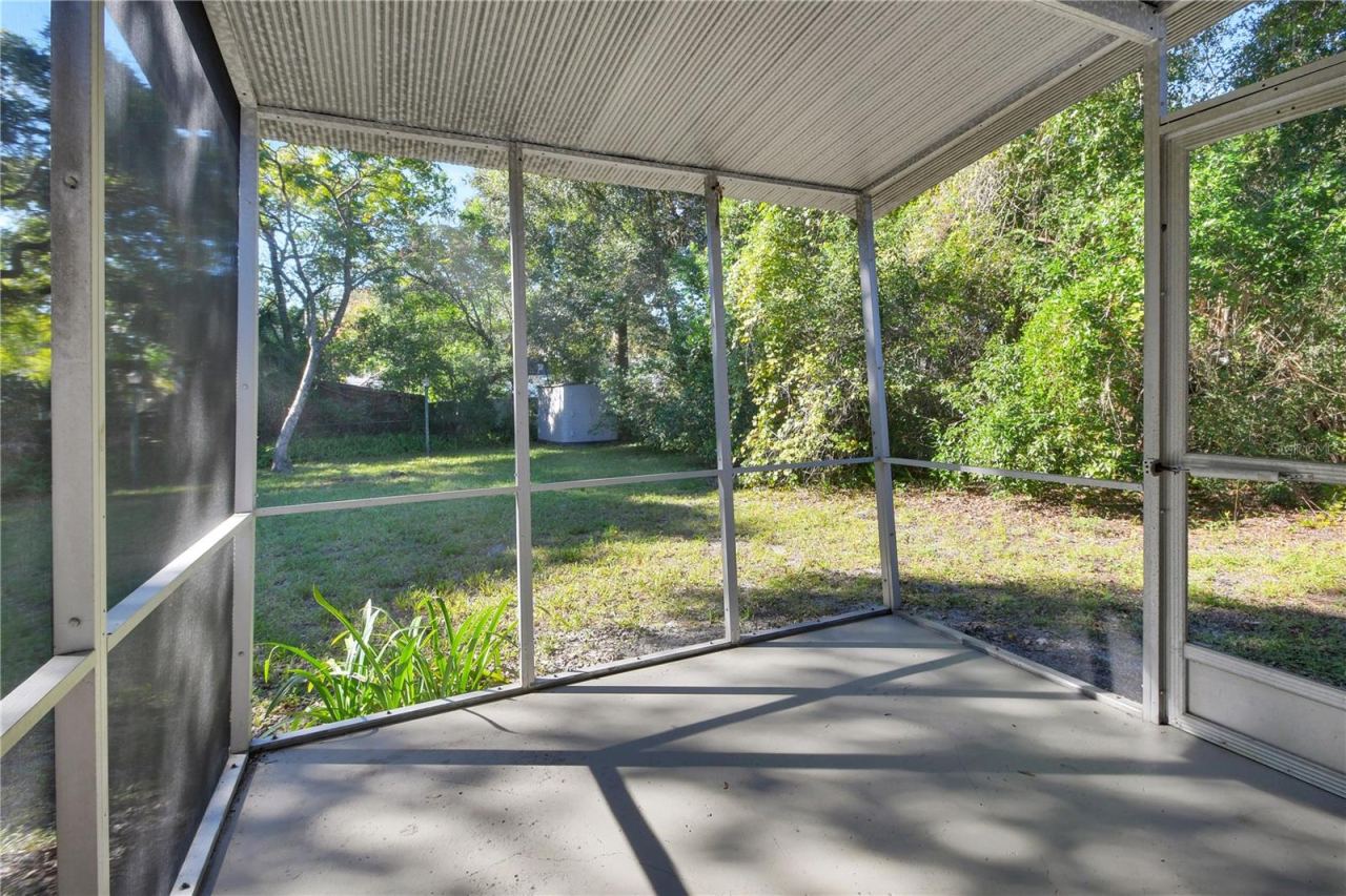 Photo 17 of 20: Screened porch with view of the storage shed